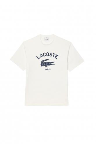 Γυναικεία Μπλούζα LACOSTE Χαρακτηριστικά: Heavy cotton jersey Άνετο κόψιμο, χαμηλωμένοι ώμοι Διαχρονική λαιμόκοψη Print στο στήθος Κεντημένος κροκόδειλος στην πλάτη Σύνθεση: Βαμβάκι (100%) / Γιακάς: 1,5 εκ: Βαμβάκι (98%), Ελαστάνη (2%) Από τη νέα μας συλλογή Άνοιξη-Καλοκαίρι 2025